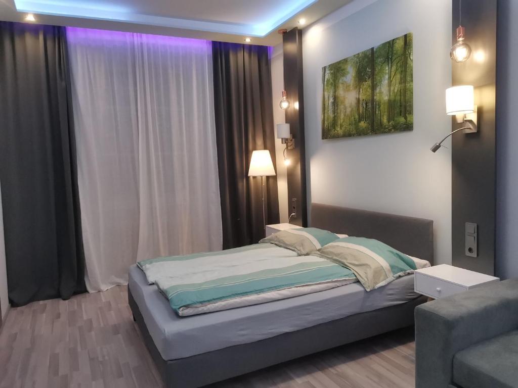 Postel nebo postele na pokoji v ubytování Elegance Apartment