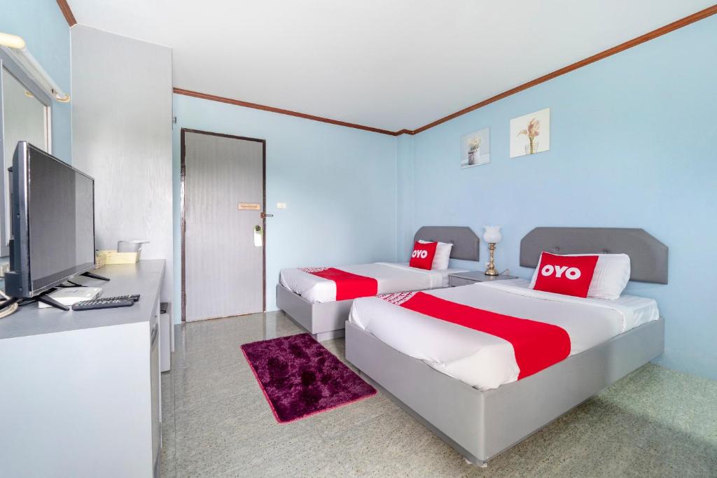 Postel nebo postele na pokoji v ubytování OYO 643 Kokview Chiang Rai
