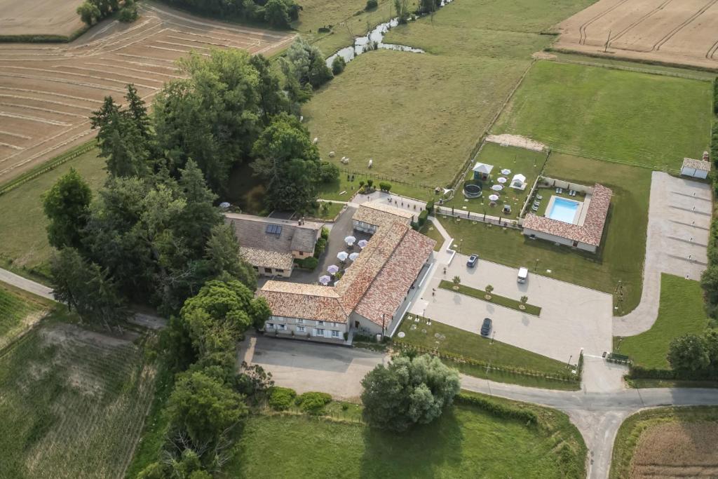 an aerial view of a large house with a yard at H&ocirc;tel du Moulin de la Brevette in Arbigny