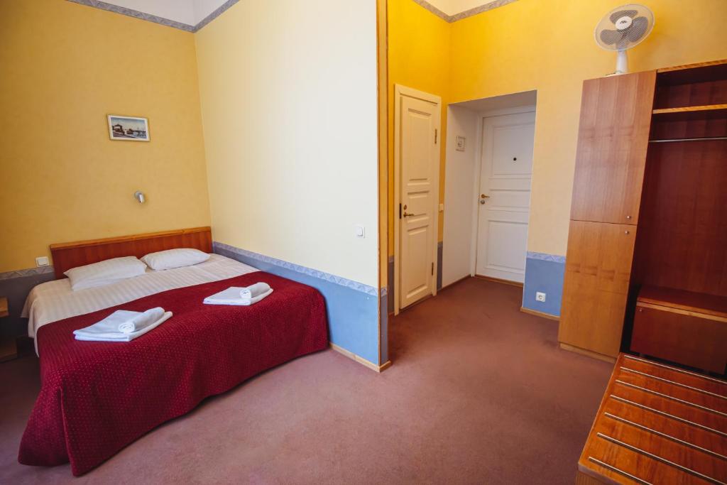 Postel nebo postele na pokoji v ubytování Hotel Promenaadi