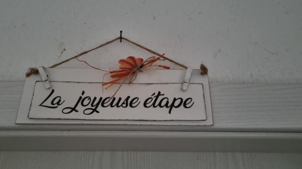 a sign that says la lyvephrinephrineride hanging on a ceiling at La joyeuse étape in Sonceboz