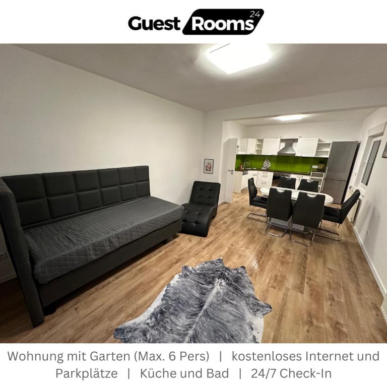 a living room with a couch and a dining room at Wohnung mit Garten EG - GuestRooms24 - Marl in Marl