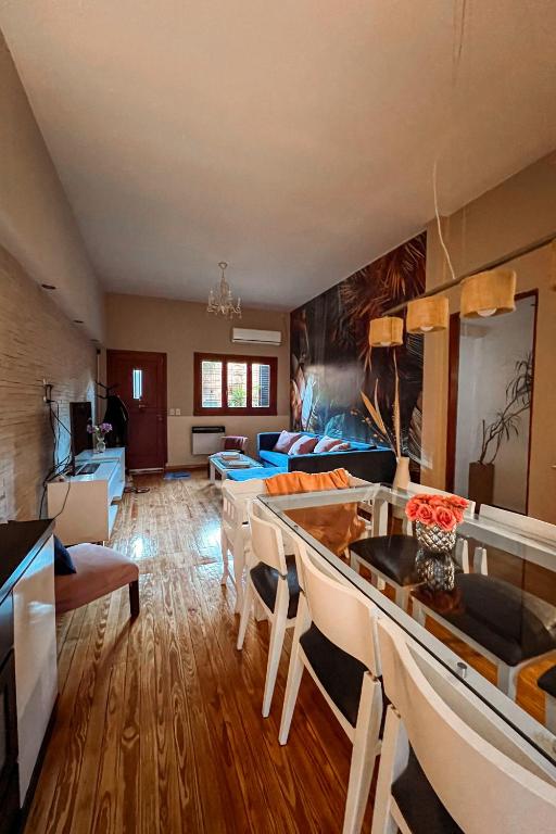 a large living room with a couch and a bed at Casa MUKAU Buenos Aires in Buenos Aires