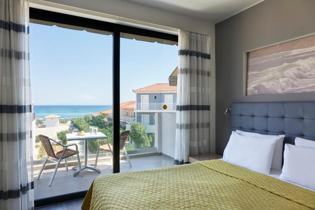 Postel nebo postele na pokoji v ubytování Paspalis Hotel