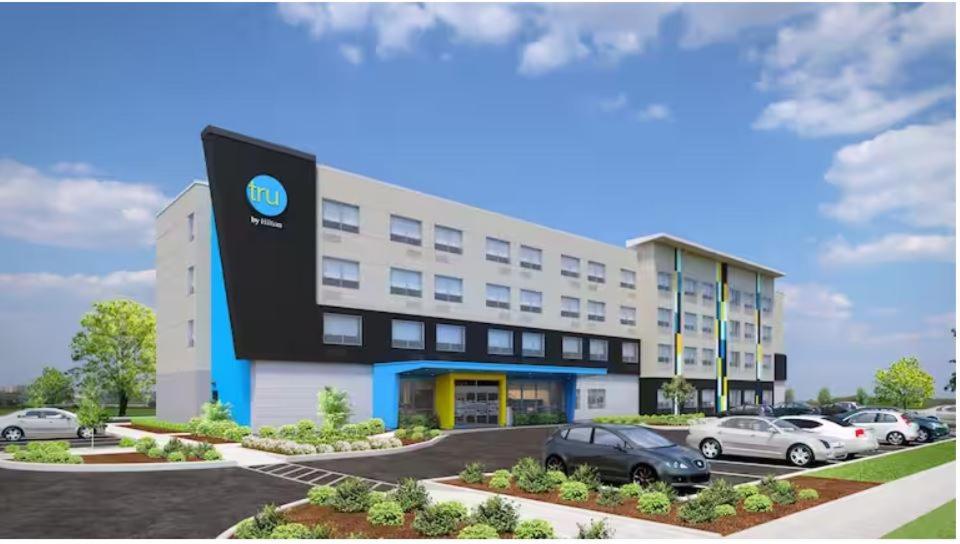 a rendering of a building with cars parked in a parking lot at Tru By Hilton Miramar in Miramar