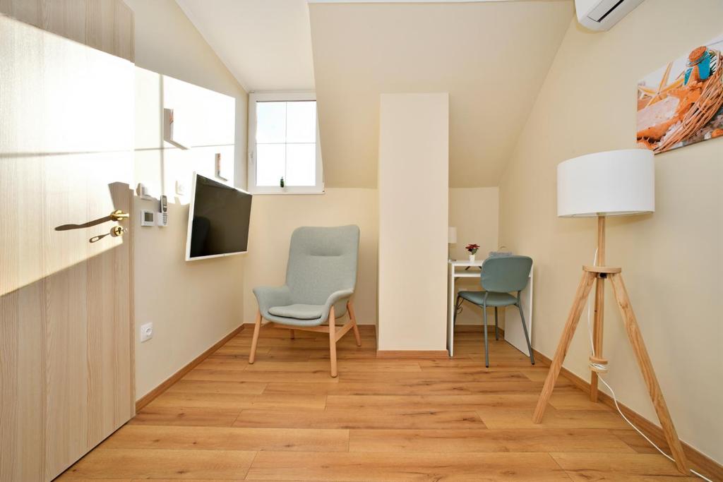 TV a/nebo společenská místnost v ubytování Palmy Apartmanhouse Maglód