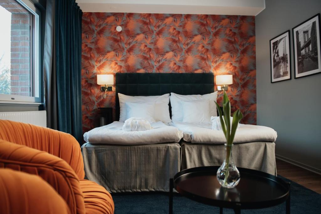 Postel nebo postele na pokoji v ubytování Quality Hotel Galaxen