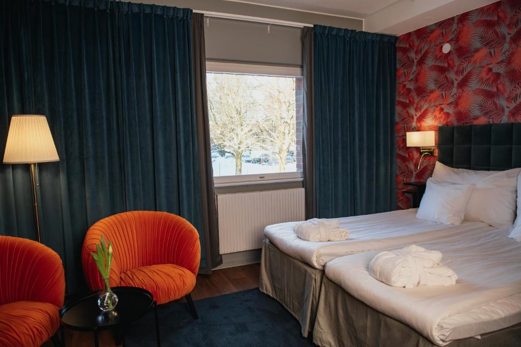 Postel nebo postele na pokoji v ubytování Quality Hotel Galaxen