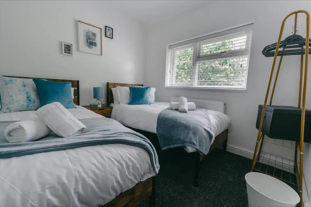 a bedroom with two beds and a window at Sapphire Lodge-Wyndale-WContractors Parking in Birmingham