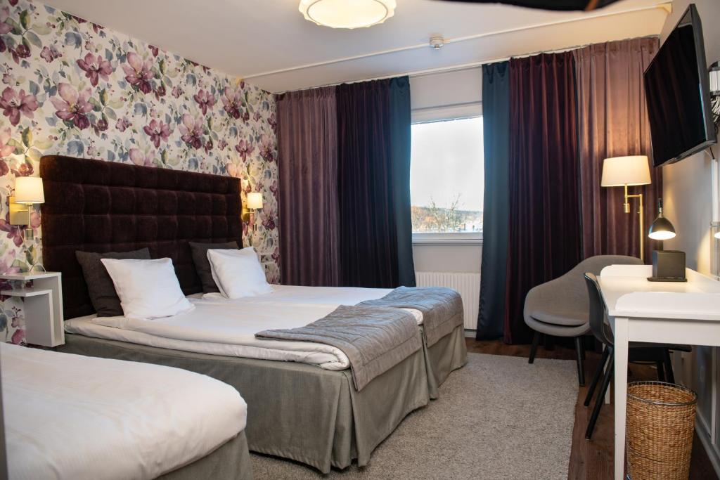 Postel nebo postele na pokoji v ubytování Quality Hotel Galaxen