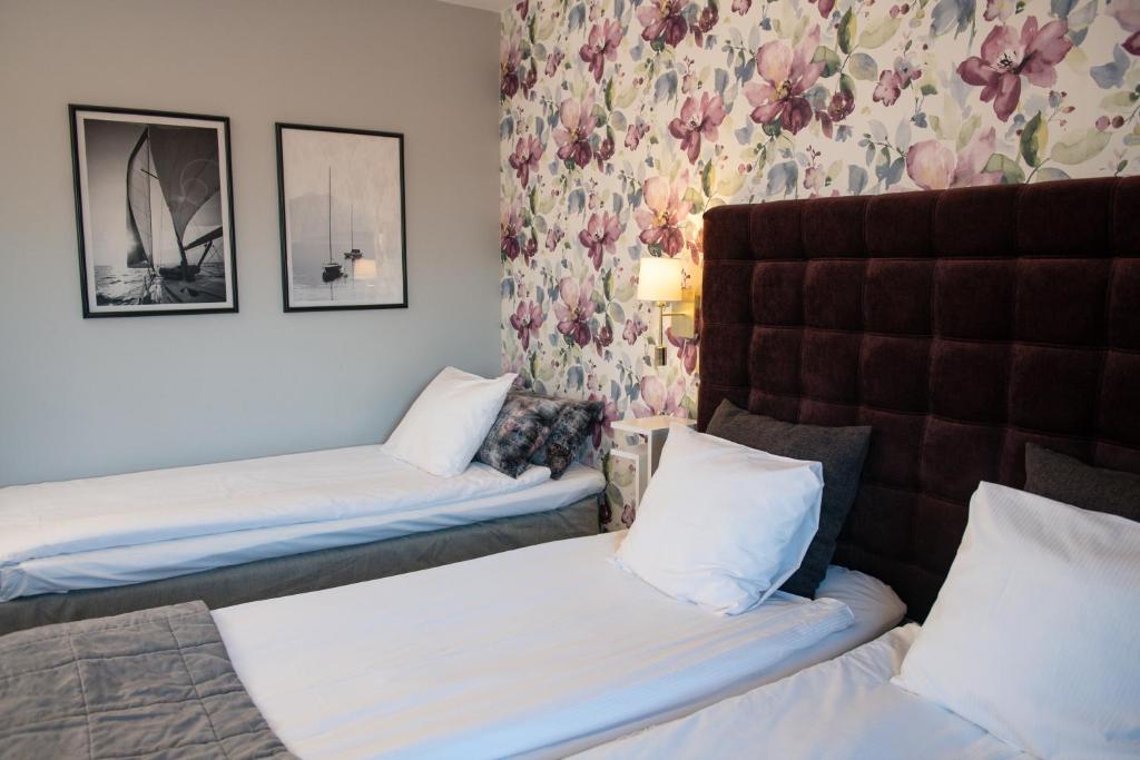 Postel nebo postele na pokoji v ubytování Quality Hotel Galaxen