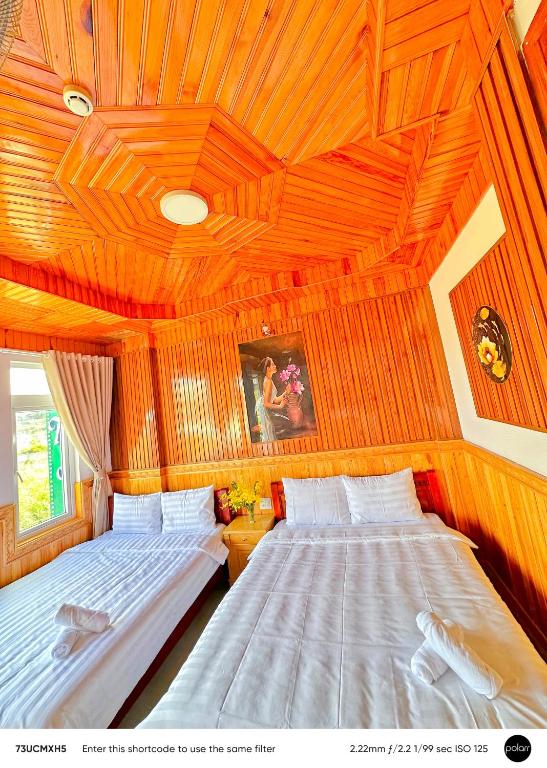 Postel nebo postele na pokoji v ubytování KHÁNH AN HOTEL
