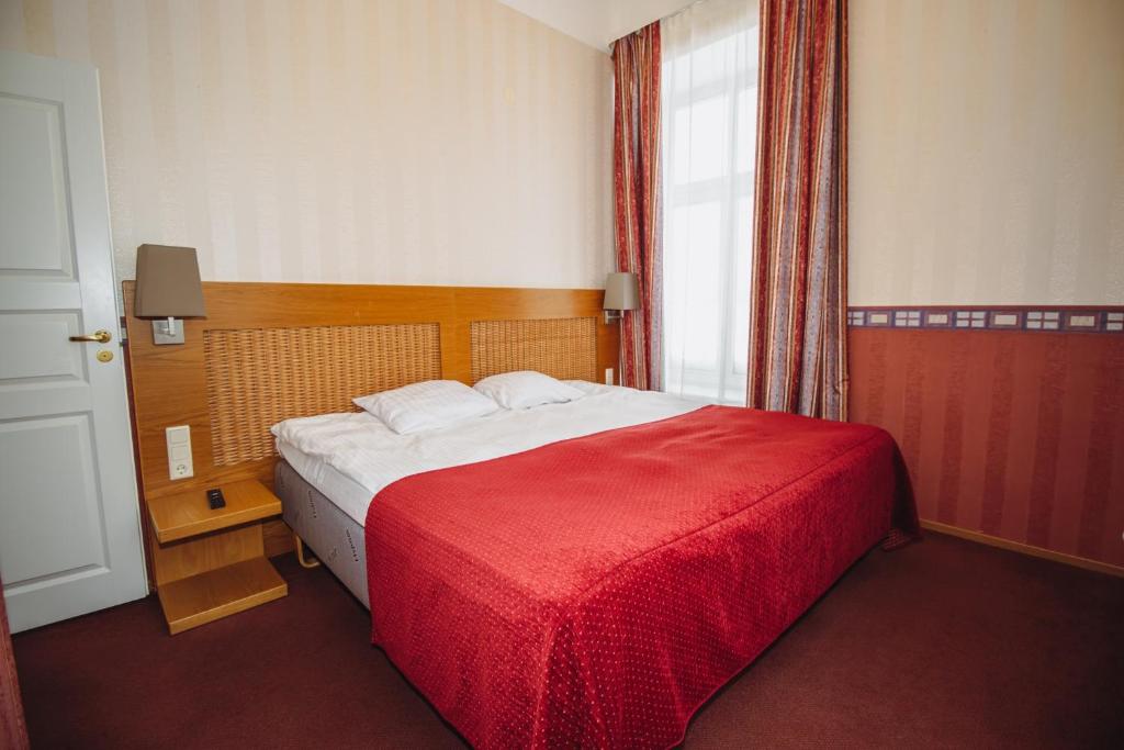 Postel nebo postele na pokoji v ubytování Hotel Promenaadi