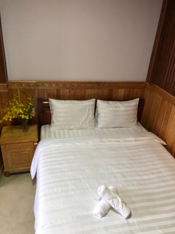 Postel nebo postele na pokoji v ubytování KHÁNH AN HOTEL
