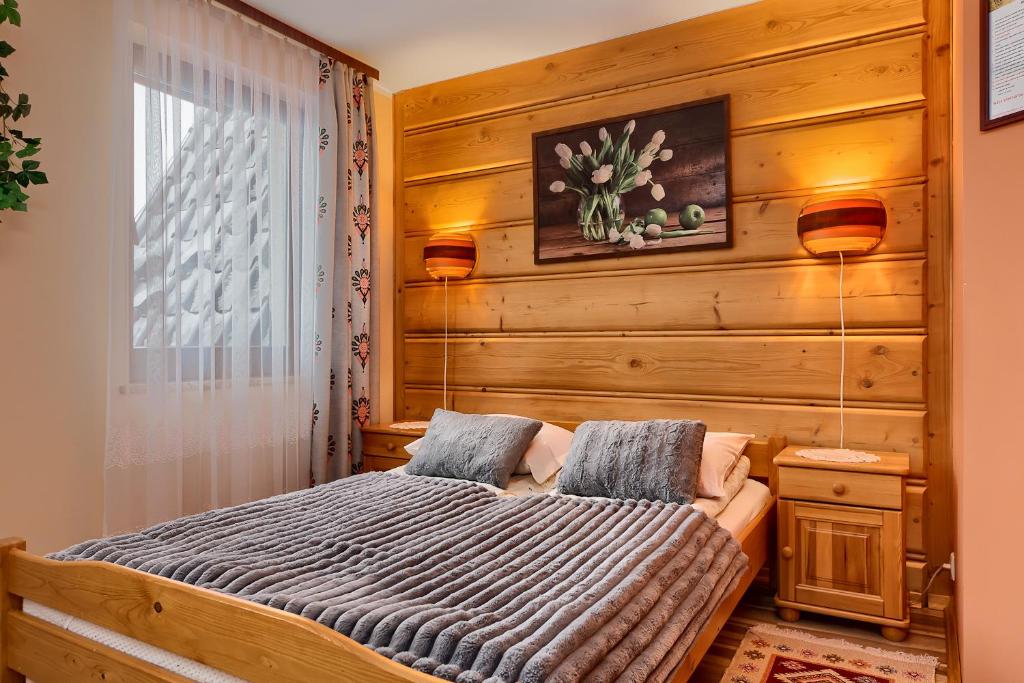 Łóżko lub łóżka w pokoju w obiekcie Willa Bartek