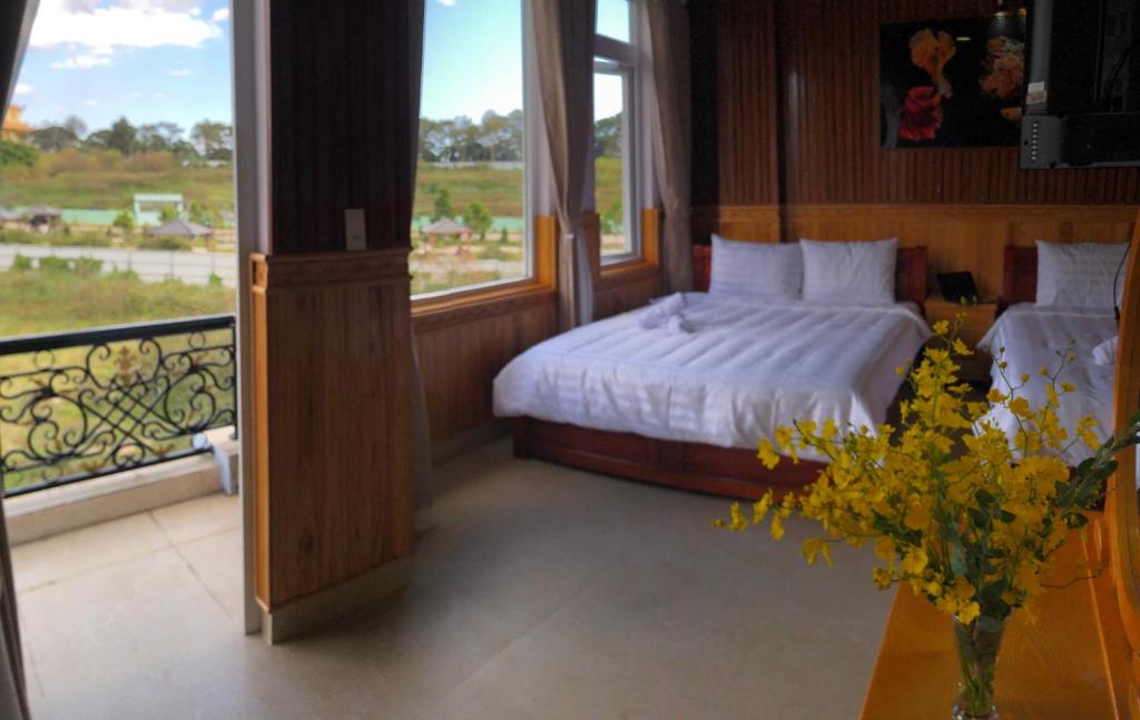 Postel nebo postele na pokoji v ubytování KHÁNH AN HOTEL