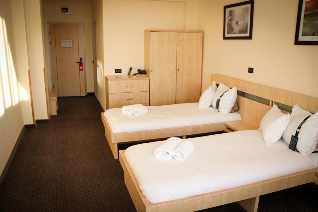 Postel nebo postele na pokoji v ubytování Hotel Clipa
