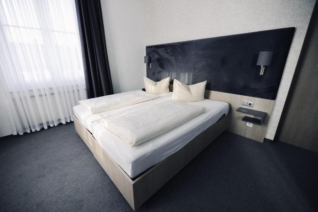 Postel nebo postele na pokoji v ubytování N9 Hotels