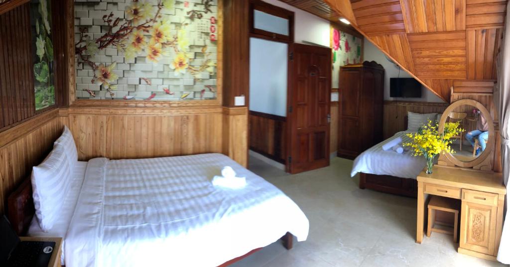 Postel nebo postele na pokoji v ubytování KHÁNH AN HOTEL
