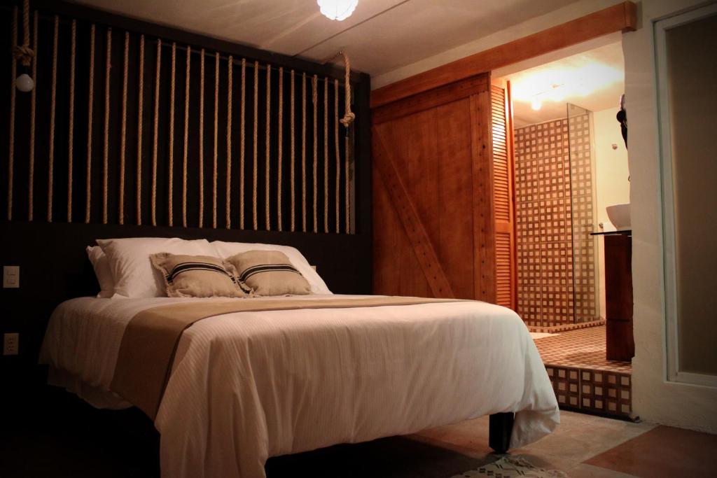 Postel nebo postele na pokoji v ubytování Hotel Damiana Boutique