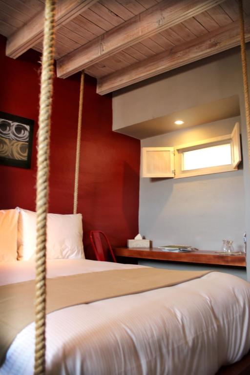 Postel nebo postele na pokoji v ubytování Hotel Damiana Boutique