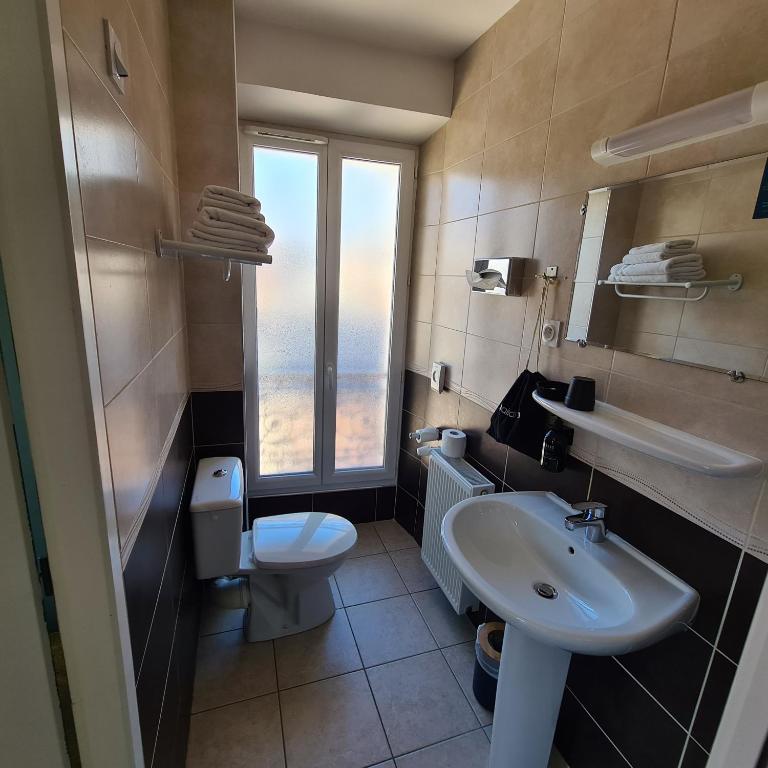 Koupelna v ubytování Le Grand Hotel