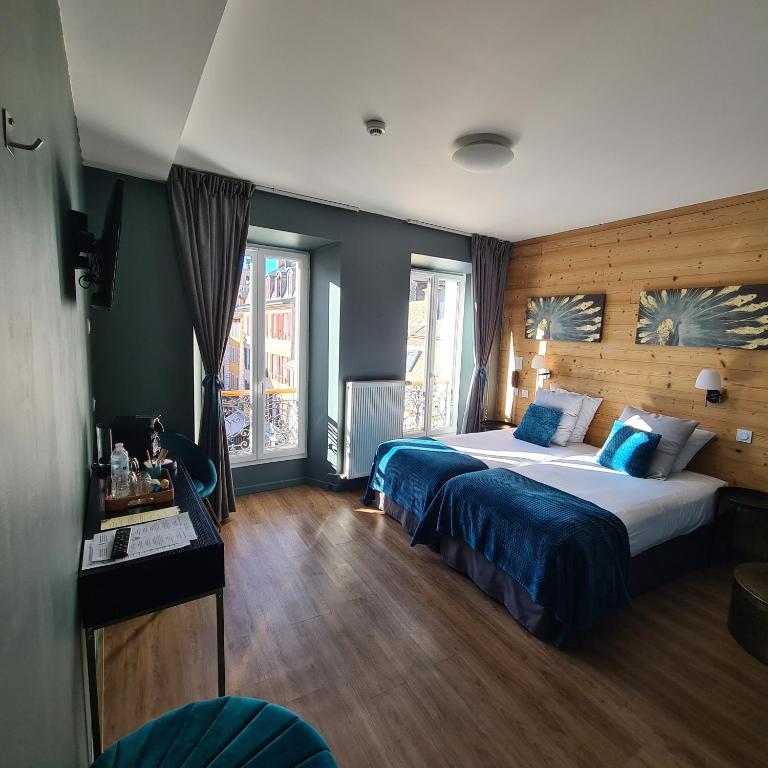 Postel nebo postele na pokoji v ubytování Le Grand Hotel