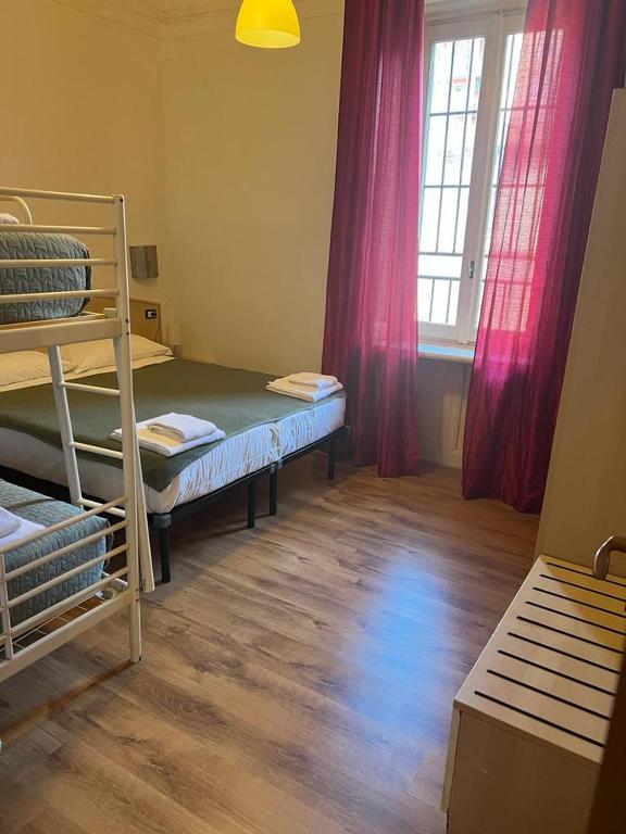a room with two bunk beds and a window at Ambra Boutique Hotel in Milan