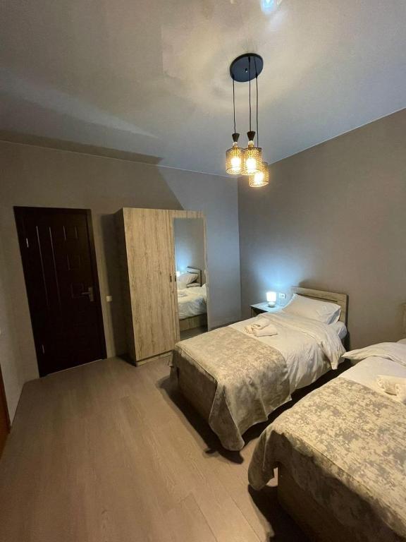 Postel nebo postele na pokoji v ubytování Hotel Lumi