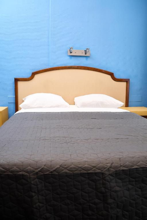 Postel nebo postele na pokoji v ubytování Hotel Derby MERODE