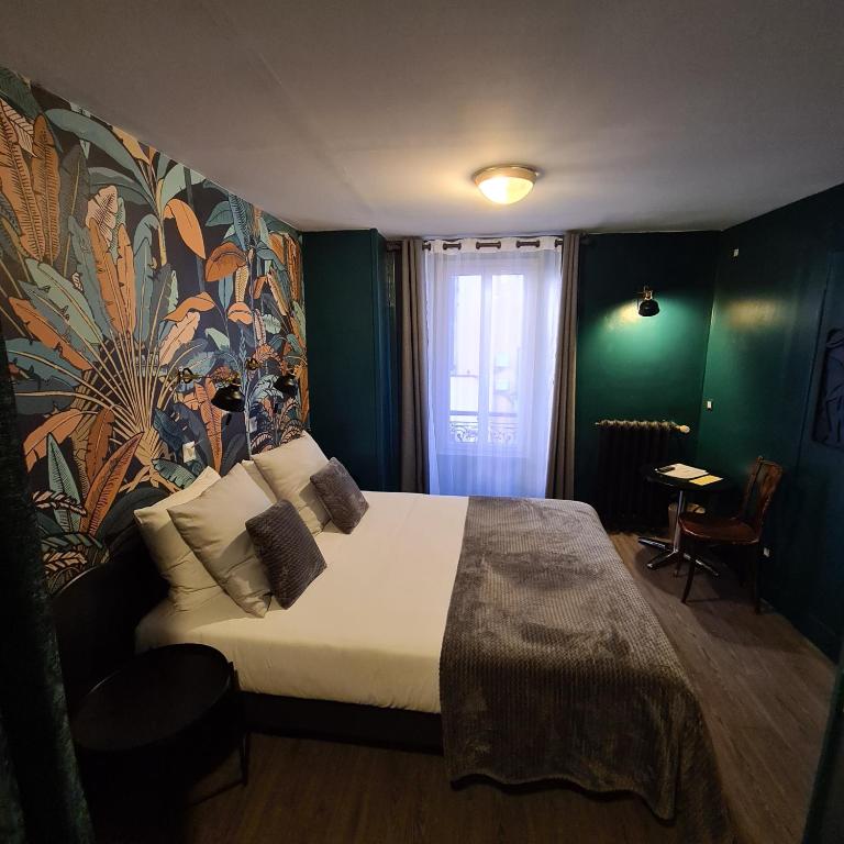Postel nebo postele na pokoji v ubytování Le Grand Hotel