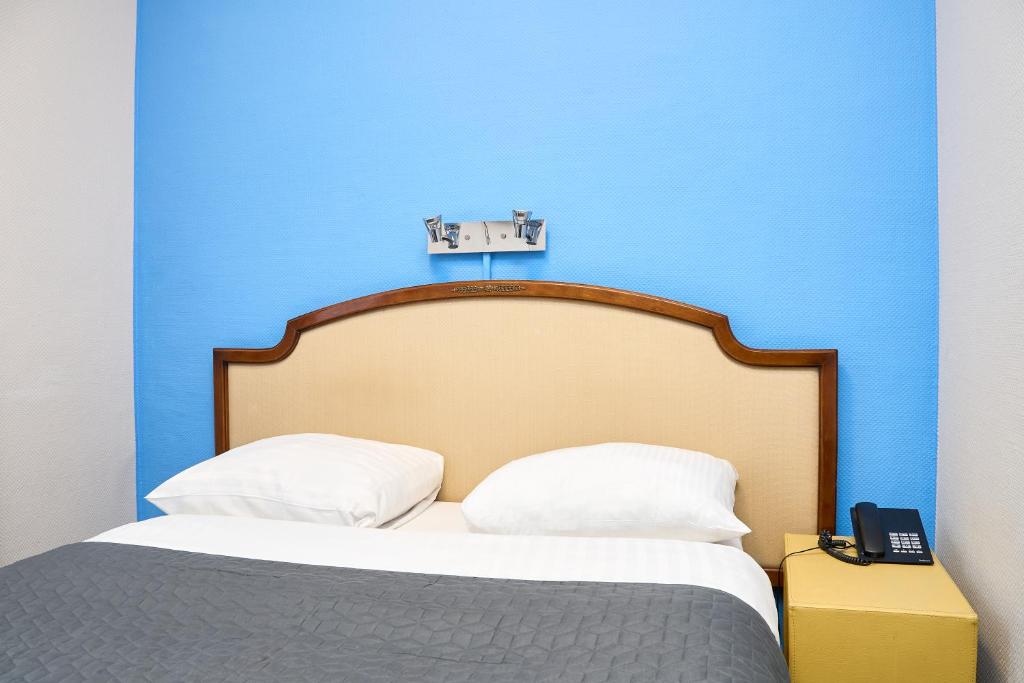 Postel nebo postele na pokoji v ubytování Hotel Derby MERODE