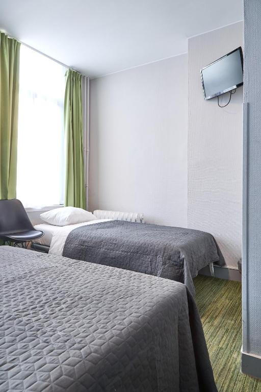 Postel nebo postele na pokoji v ubytování Hotel Derby MERODE
