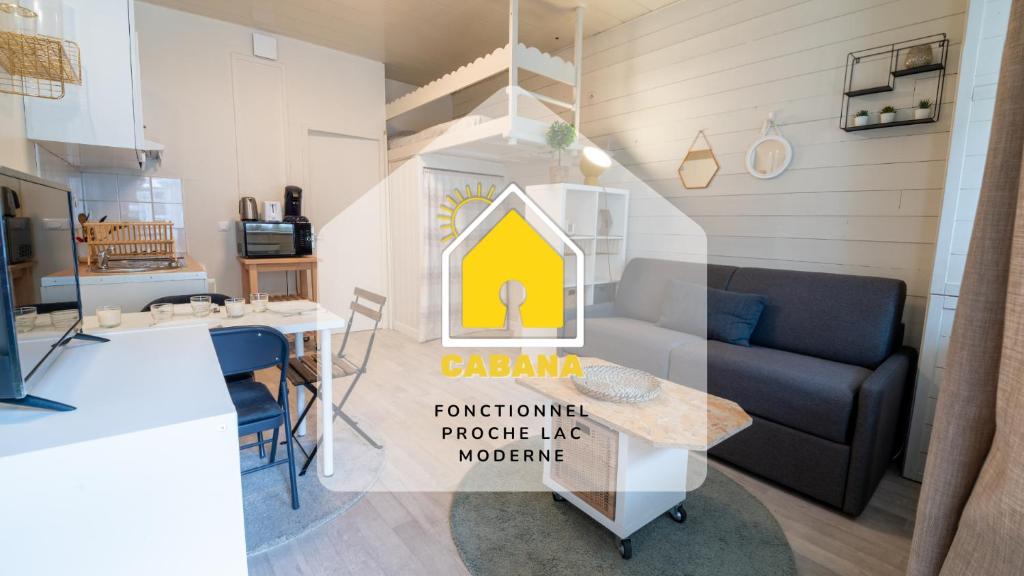 a kitchen and a living room with a table at CABANA & Perle de Lac - Proche du Lac in Sévrier