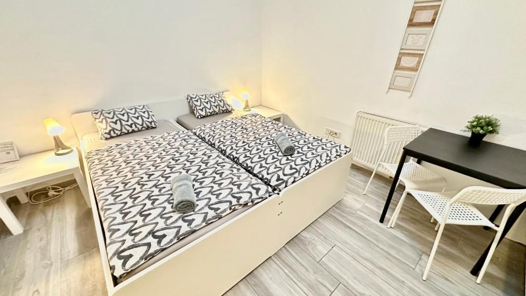 Postel nebo postele na pokoji v ubytování Center Station ROOMS