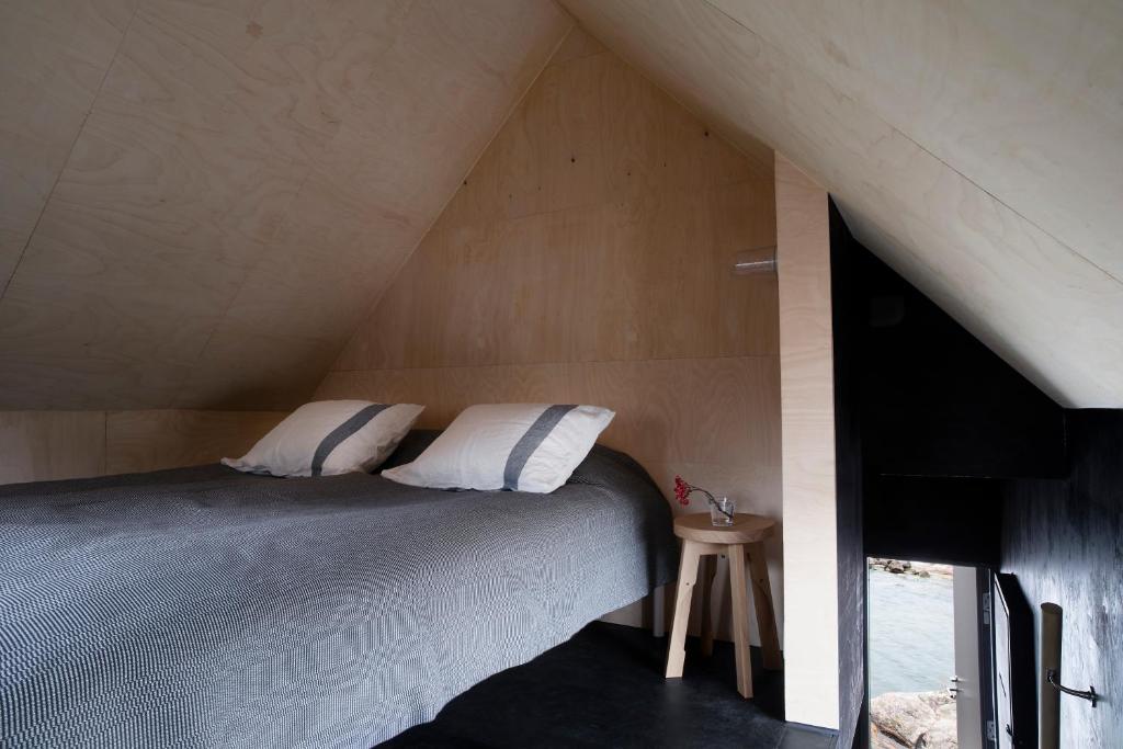 Postel nebo postele na pokoji v ubytování Majamaja Helsinki off-grid retreat