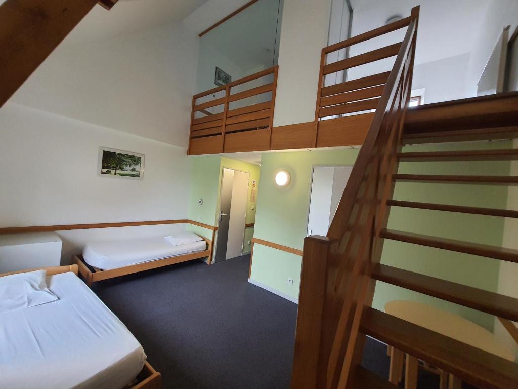 Postel nebo postele na pokoji v ubytování Gîte de Manehouarn