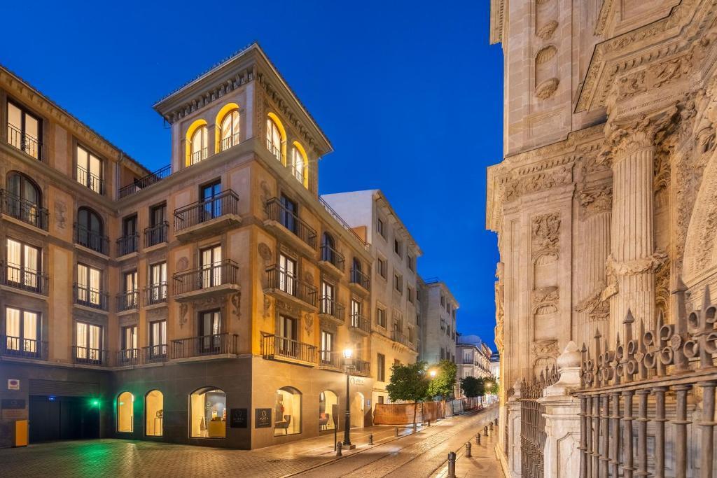 a building in a city at night at Áurea Catedral by Eurostars Hotel Company in Granada