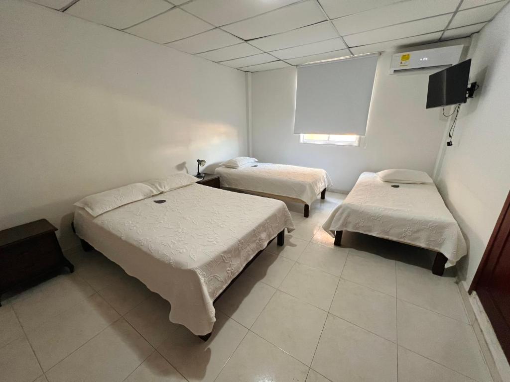 Postel nebo postele na pokoji v ubytování Hotel Dorado Plaza Centro Histórico