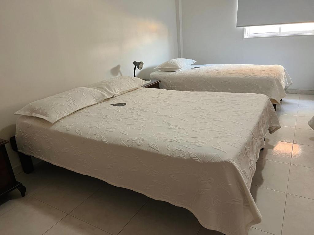 Postel nebo postele na pokoji v ubytování Hotel Dorado Plaza Centro Histórico