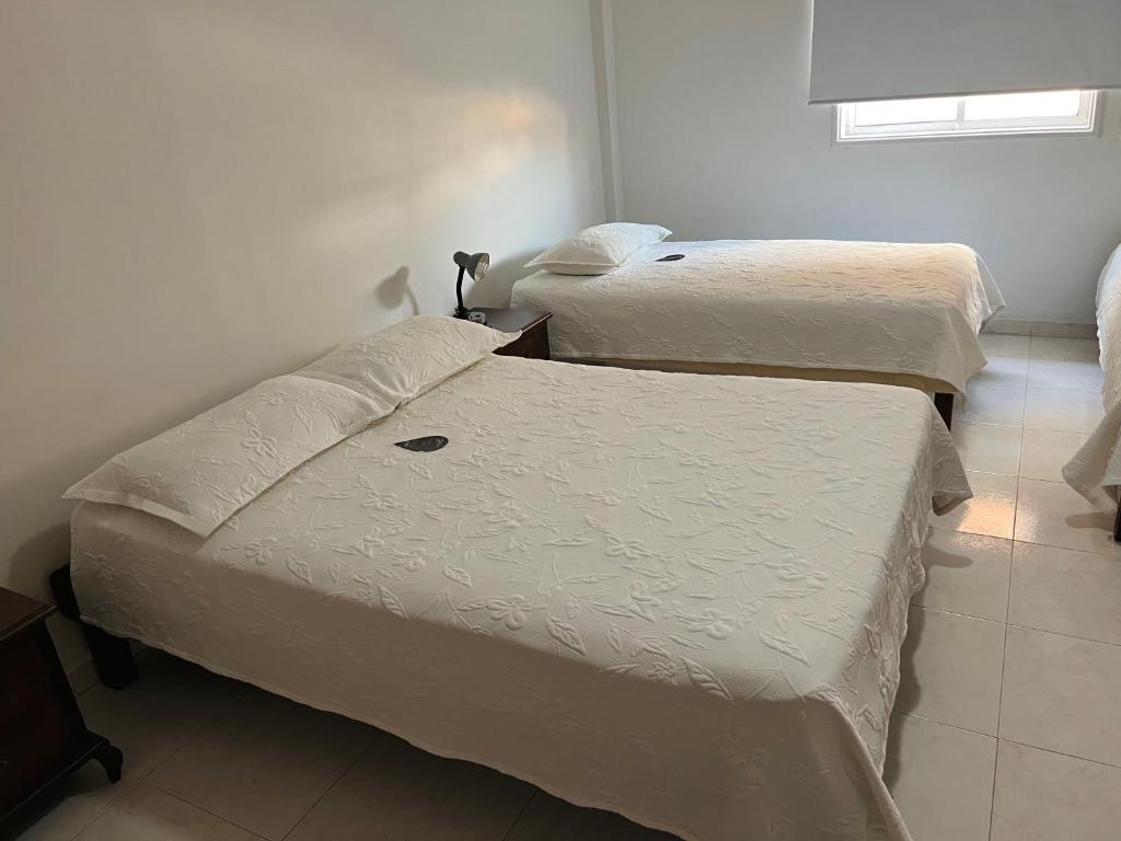 Postel nebo postele na pokoji v ubytování Hotel Dorado Plaza Centro Histórico