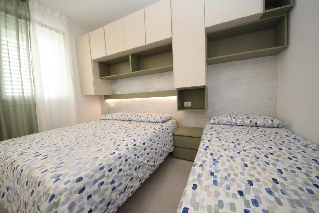 Postel nebo postele na pokoji v ubytování Ca' Del Mare