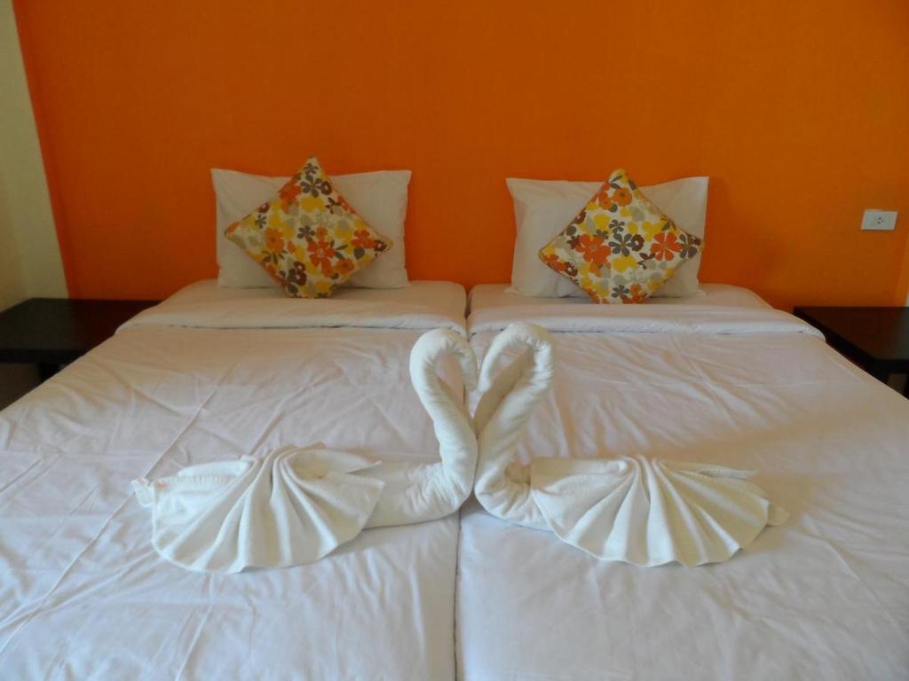 Posteľ alebo postele v izbe v ubytovaní OYO 902 Life & Love Resort