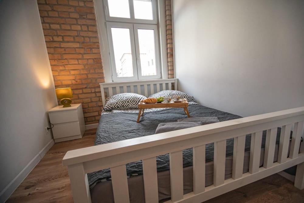 Posteľ alebo postele v izbe v ubytovaní apartament Rynek