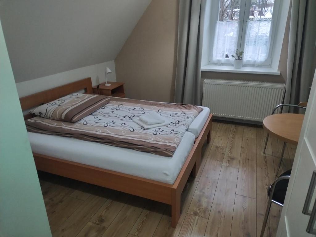 Postel nebo postele na pokoji v ubytování Lipanka