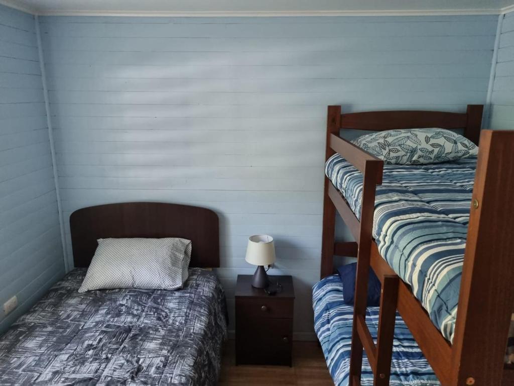 Postel nebo postele na pokoji v ubytování Cabañas Alto Quillay, radal siete tasas