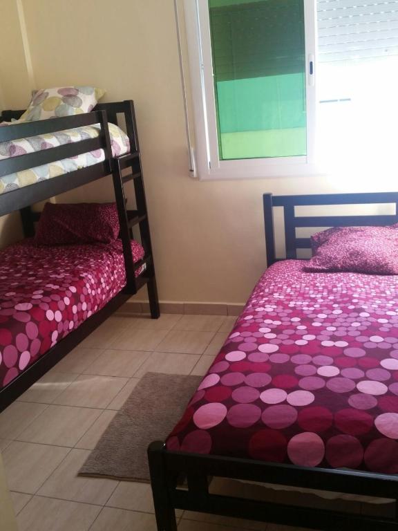Postel nebo postele na pokoji v ubytování Apartment Martil