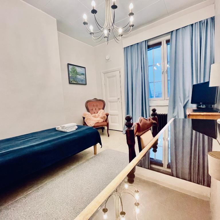 TV a/nebo společenská místnost v ubytování Senate Hotel