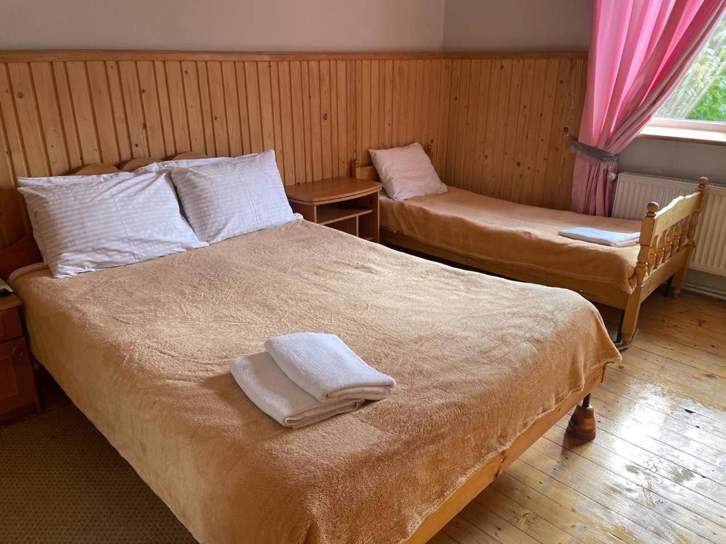 Postel nebo postele na pokoji v ubytování Kolo Druziv
