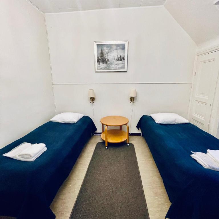 Postel nebo postele na pokoji v ubytování Senate Hotel
